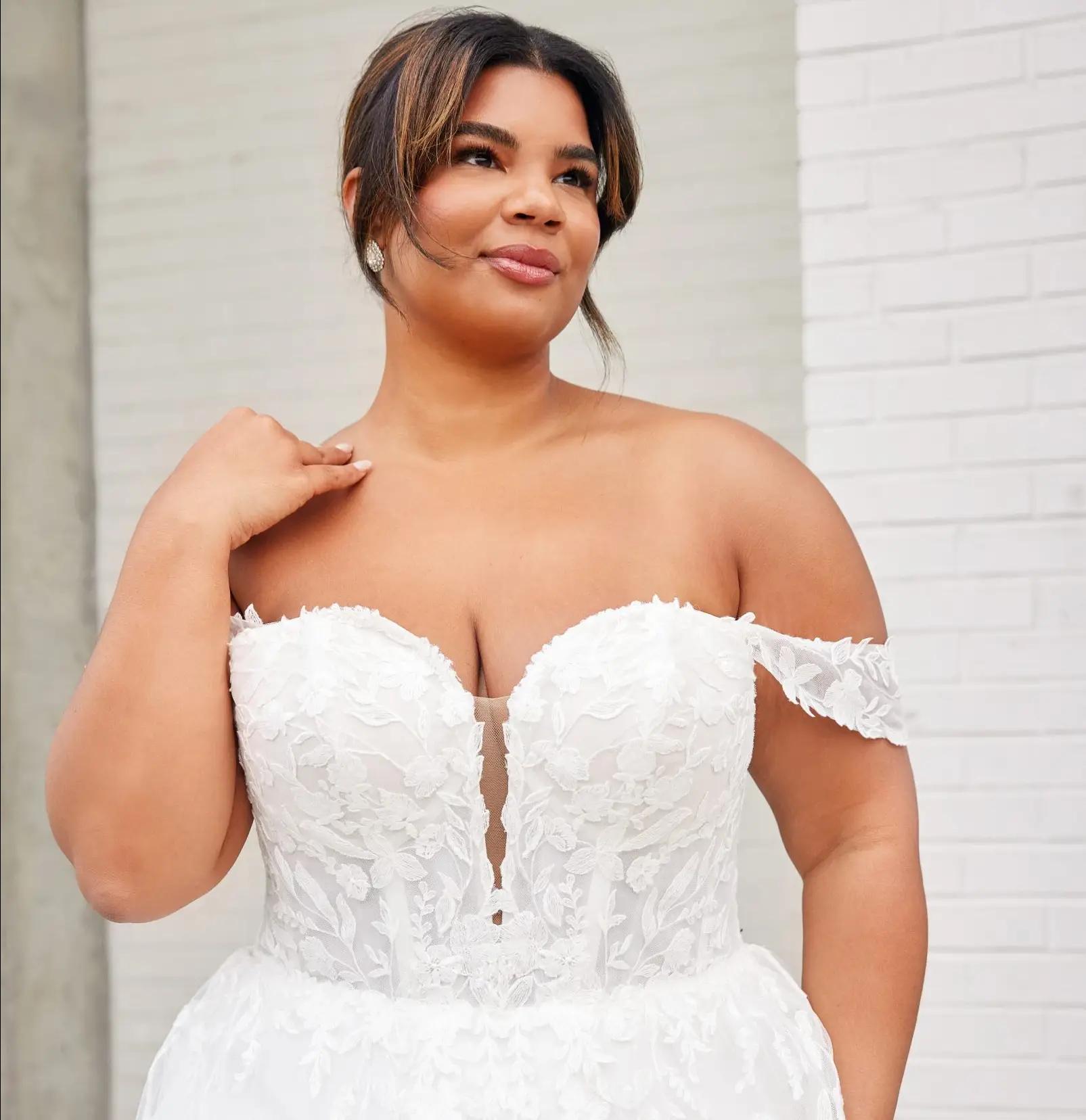 Photo of Model wearing a Blush Bridal Salon Plus Size Collection Gown