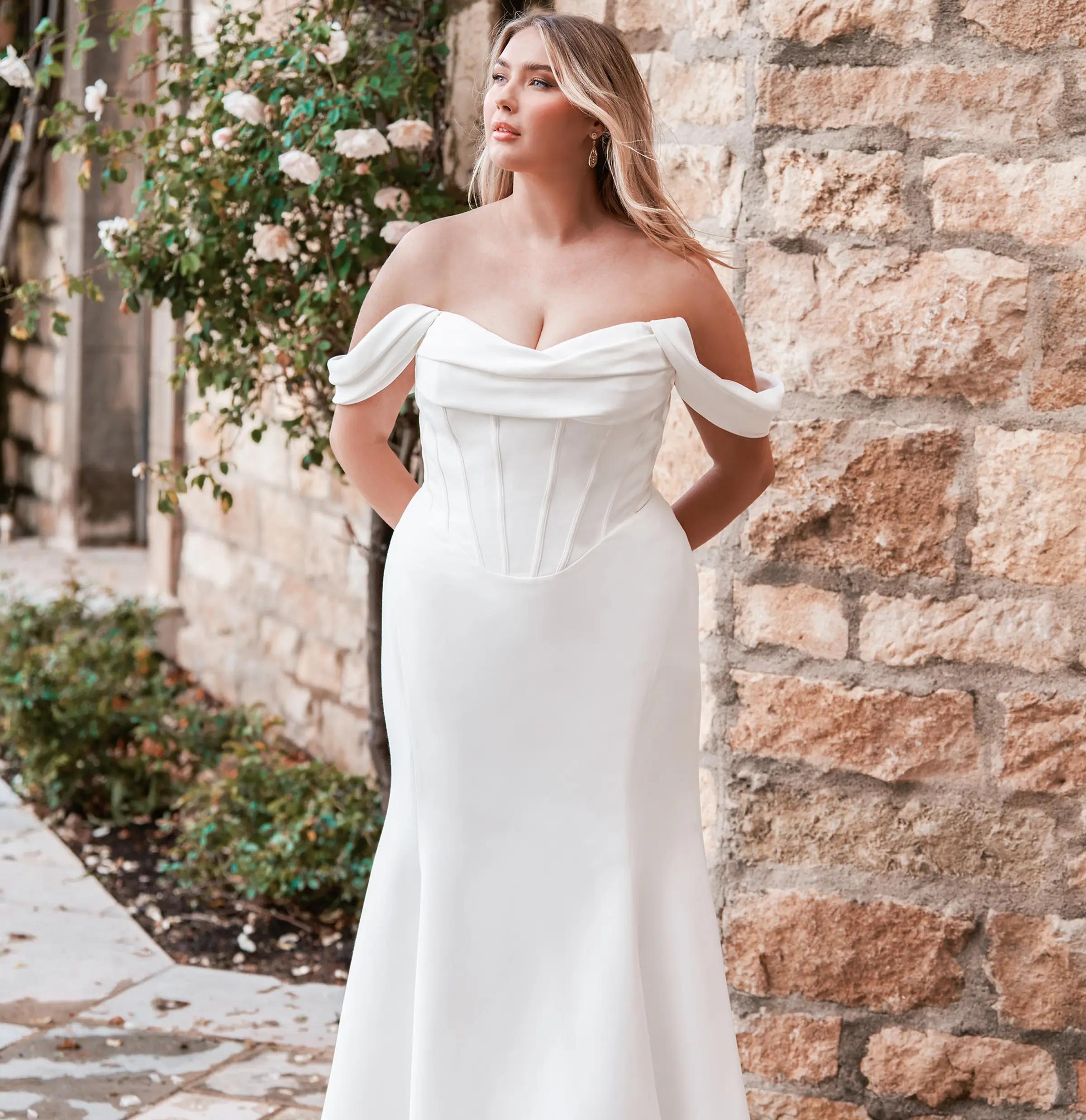 Photo of Model wearing a Blush Bridal Salon Plus Size Collection Gown